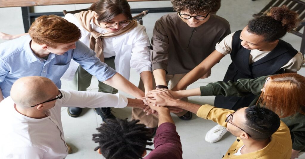 Team putting hands together