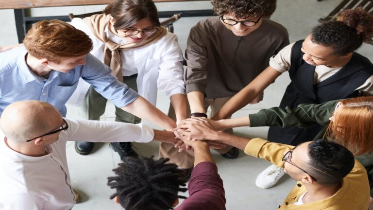 Team putting hands together